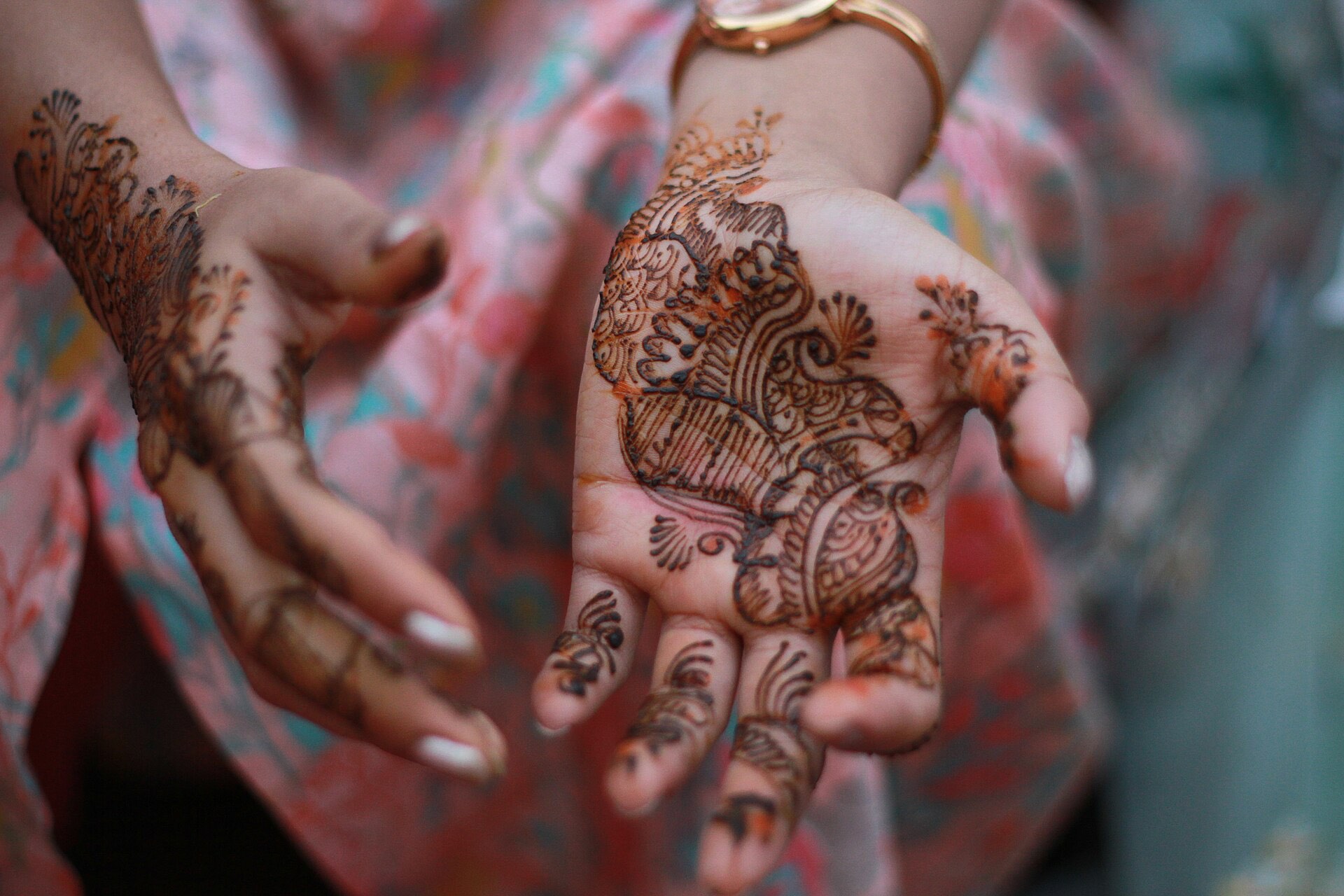 Bridal hands covered in intricate mehndi